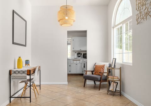 Natural light fills this stylish living space, creating welcoming atmosphere