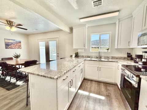 The kitchen and dinng area in Unit 1 is open to the living room which makes gathering with friends and family easy and fun