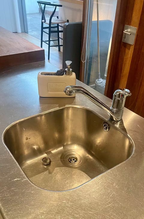 GROUND FLOOR. Kitchen Counter in Stainless Steel & Wood Butchers Block.