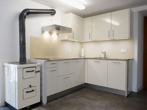 Countertop, Kitchen, Cabinetry, Kitchen Appliance, Major Appliance, Furniture, Interior Design, Flooring, Sink, Drawer