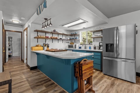 Down the hall to the left is Bedroom & Bathroom 2 and the laundry/pantry room