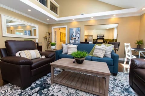 Relax and recharge in our cozy living room, featuring comfortable couch seating.