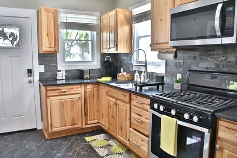 Full kitchen ideal for extended stay cook, dine, and feel right at home.