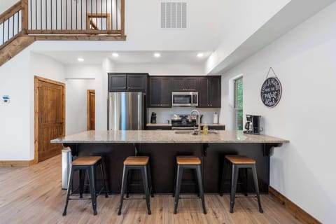 The chic, open kitchen offers ample space & every home comfort