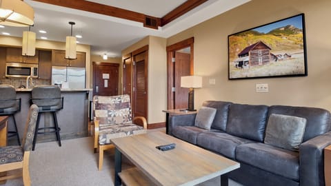 Cozy living space with sofa and natural light.