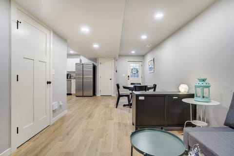 The open-concept layout offers a seamless flow from the living area to the kitchen and dining space, making it easy to gather, dine, and unwind together in comfort.