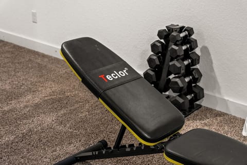 Lower level game room with ping pong, board games, and exorcise equipment