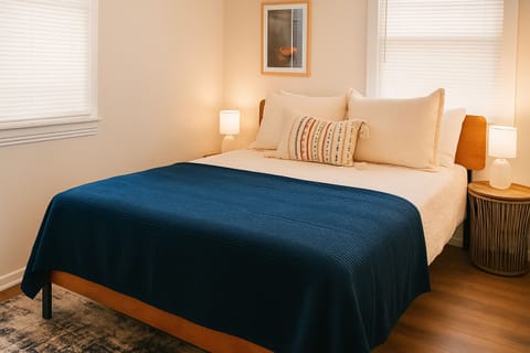 Bedroom with Queen bed, Smart TV, Two side tables, Two table lamps, Ceiling Fan & Rug