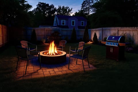 Back yard with firepit, chairs & gas grill