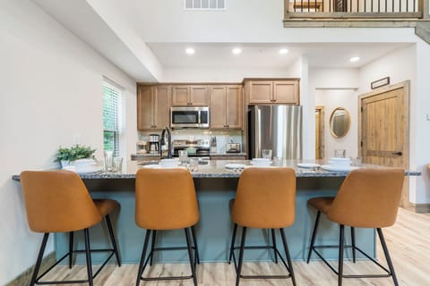 Full Kitchen with Upgraded Appliances, Additional Bar Seating