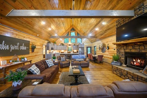 Bright living space with sofa sleeper, gas fireplace, and Smart TV