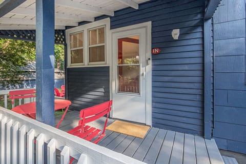 Front porch with a screen door and sensor light.