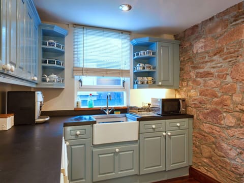 Kitchen, Countertop, Cabinetry, Kitchen Appliance, Interior Design, Furniture, Flooring, Major Appliance, Wood, Drawer