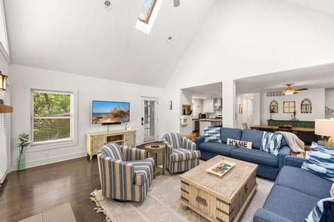 Cozy up beneath the vaulted ceiling glow.