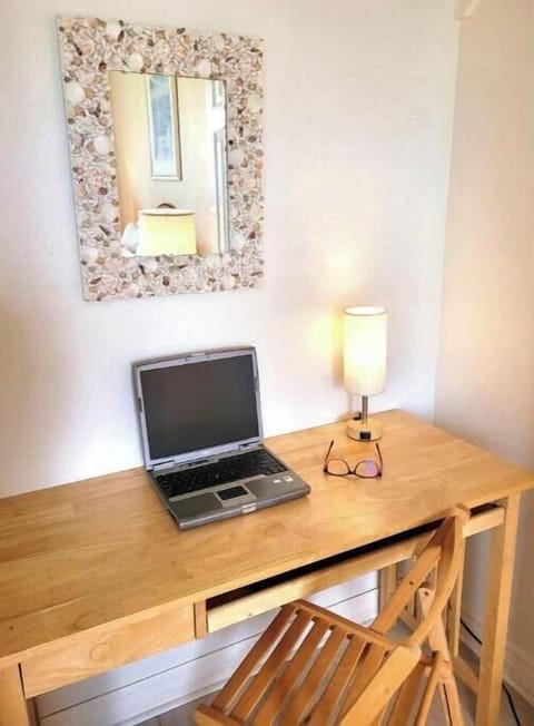 Bedroom 2 features a dedicated desk/workspace.