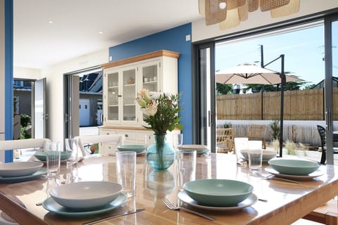 Dining area with large square table seating 8, direct access to terrace