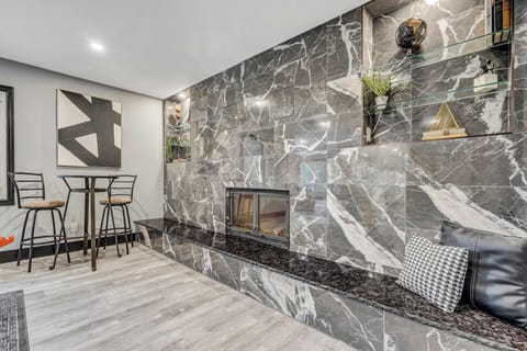 Elegant stone fireplace with built-in seating—adds warmth, style, and a cozy place to unwind after a day of adventure.