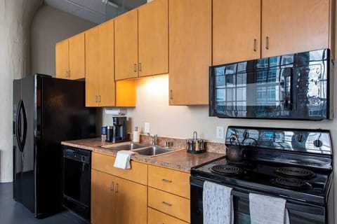 Kitchen 2 is fully stocked, including a Keurig with assorted coffee cups.