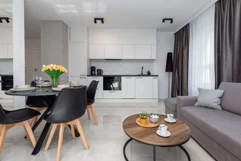 Kitchenette with plenty of kitchen utensils and dishes.