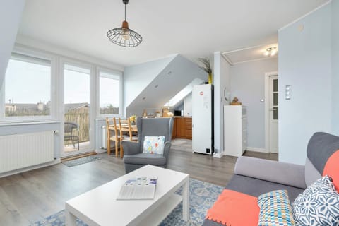 Large windows by the dining table offer city views to enjoy with your meals.