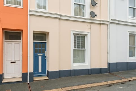 The colourful front door welcomes you home