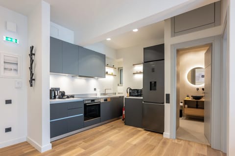 Modern and stylish kitchen with sleek design and warm lighting for cosy stays.