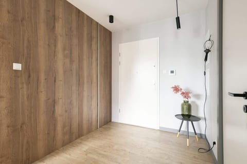 Minimalist design with a large mirror adding a sense of space.