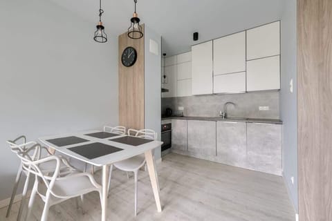 Stylishly decorated space with a dining table and chairs, perfect for shared meals.