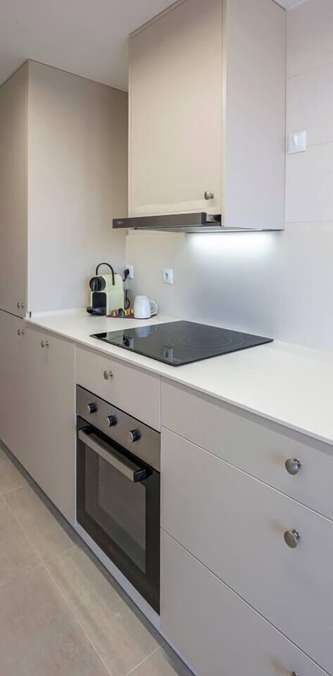 Kitchen with washer and ample storage. (1)