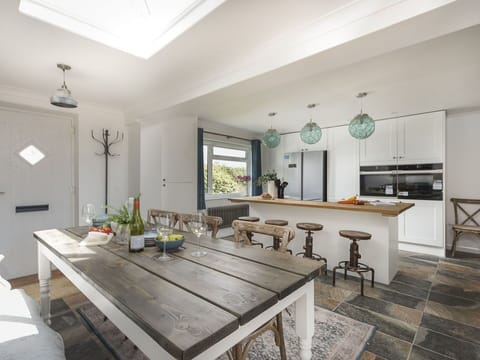 Furniture, Interior Design, Flooring, Floor, Wood, Kitchen, Ceiling, Light Fixture, Countertop, Kitchen & Dining Room Table