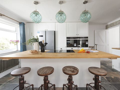 Furniture, Interior Design, Flooring, Light Fixture, Countertop, Wood, Ceiling, Kitchen, Floor, Chandelier