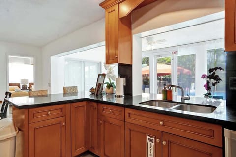 Dual-sink setup with stainless appliances, coffee station, and plenty of counter space. | Best vacation rental kitchen setup.
