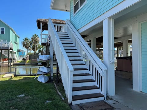 Stairs to the upper level living deck and living area.