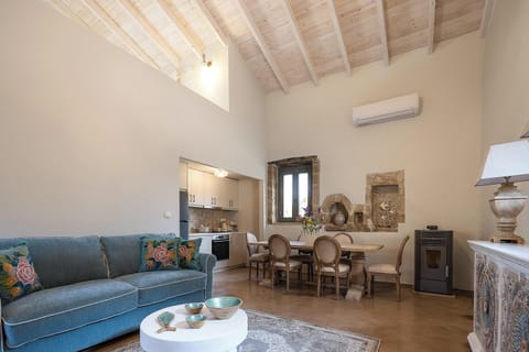 Main Building - The living area includes a sofa and a pellet fireplace for the chilly evenings.