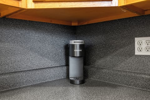 Enjoy your morning coffee with a convenient one-cup Keurig, perfect for a quick brew.