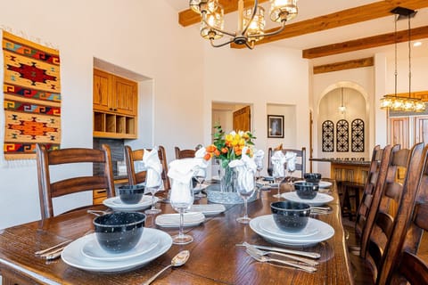 Dining table seats 8 with added leaf to extend for 12 guests