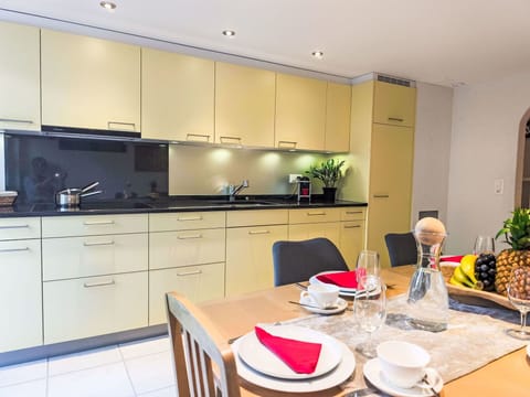 Interior Design, Countertop, Kitchen, Kitchen Appliance, Furniture, Flooring, Major Appliance, Cabinetry, Lighting, Floor