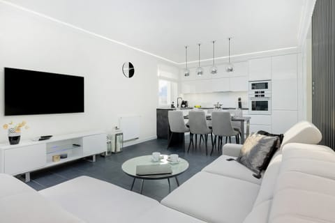 Living room with a comfortable sofa and TV. 