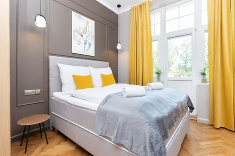 The living area's bold color palette creates a cheerful and inviting atmosphere.