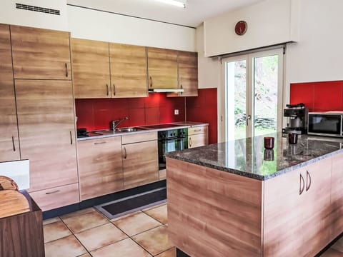 Kitchen, Kitchen Appliance, Flooring, Countertop, Furniture, Cabinetry, Major Appliance, Floor, Interior Design, Wood