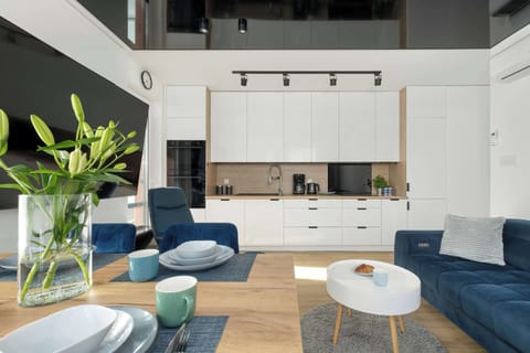 The open-plan living area combines the comfort of the lounge with the practicality of a dining space and kitchen.