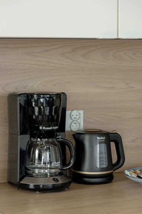 The coffee maker and kettle offer a convenient start to your day with your favorite drink at hand.