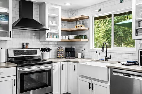 Fully stocked kitchen with coffee station.