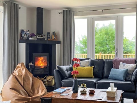 Relax by the fire. | Go Ye Cottage, Achmore