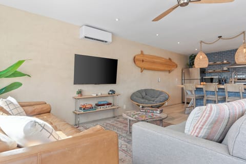 Unit A stylish living room with comfy seating and natural light.