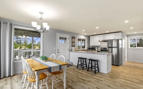Dining room table and two stools at the bar