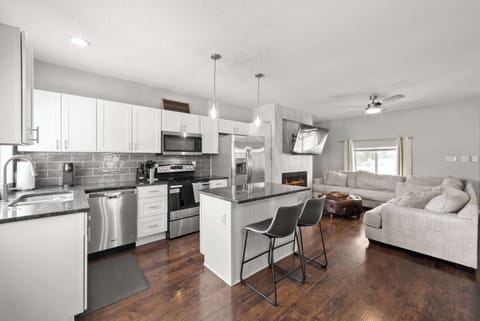 The sleek, open kitchen offers ample space & all the comforts of home​