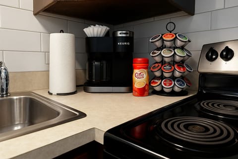 Fully stocked coffee and tea station with a Keurig, pods, and essentials.