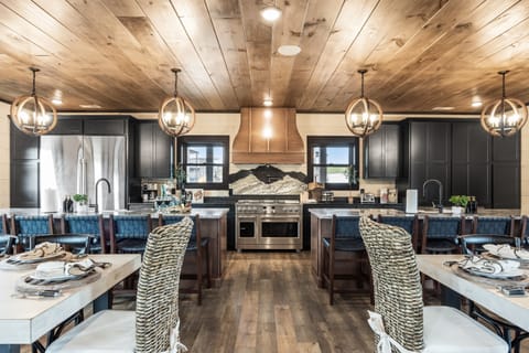 Cook with ease in this fully stocked kitchen featuring modern appliances, double ovens, and plenty of space. Whether you're preparing simple meals or a group dinner, you’ll find everything you need right at your fingertips.