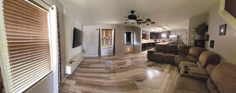 The living room comfortably seats up to 7 guests, offering a cozy space to relax